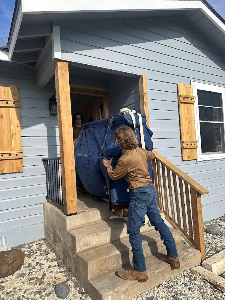 Apartment Move-In and Move-Out Inspection Guide for San Antonio Renters 1 Movers carrying a wrapped item during a San Antonio apartment move