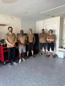 Professional packers wrapping fragile items and labeling boxes for a San Antonio move
