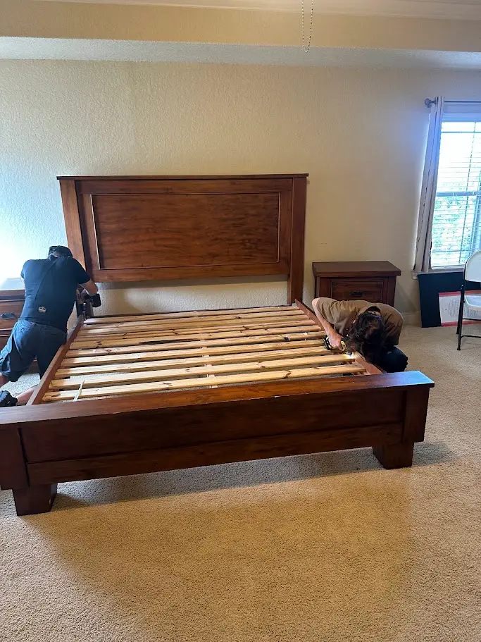 Piano Moving Cost Guide for San Antonio: What to Expect 1 Movers disassembling a bed frame for a specialty item move in San Antonio