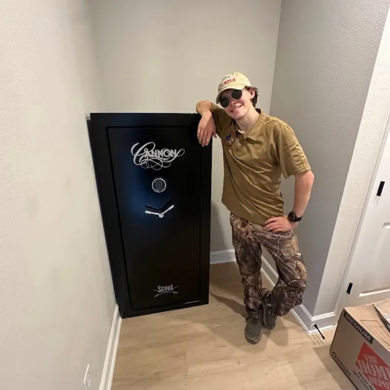 Movers navigating a stairwell with boxes during an apartment move in San Antonio